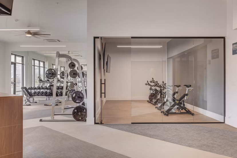 State-of-the-art fitness center at The Heights at Legend Hills Apartments with modern equipment and spacious workout areas