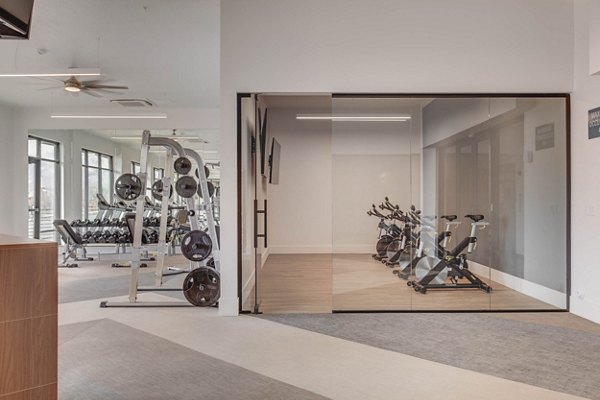 State-of-the-art fitness center at The Heights at Legend Hills Apartments with modern equipment and spacious workout areas