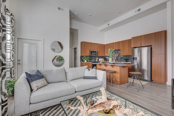 Spacious living room with modern decor in The Heights at Legend Hills Apartments