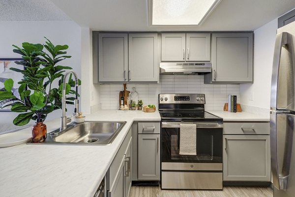 Modern kitchen with stainless steel appliances at Shift Apartments