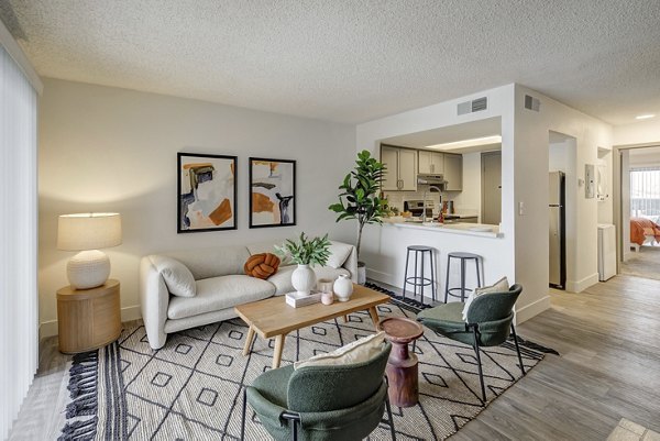 Modern living room with sleek furniture and large windows in Shift Apartments, offering luxury living in a Greystar community