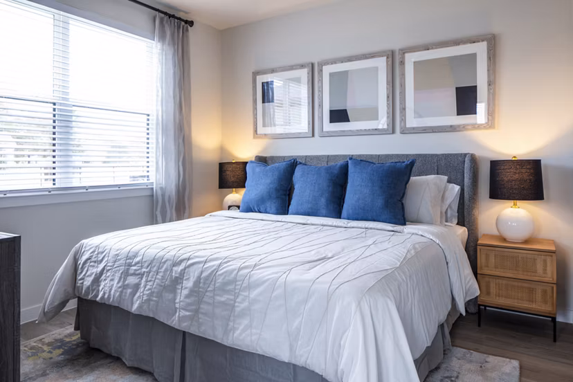 Cozy bedroom with modern decor at Prose Hardy Yards Apartments