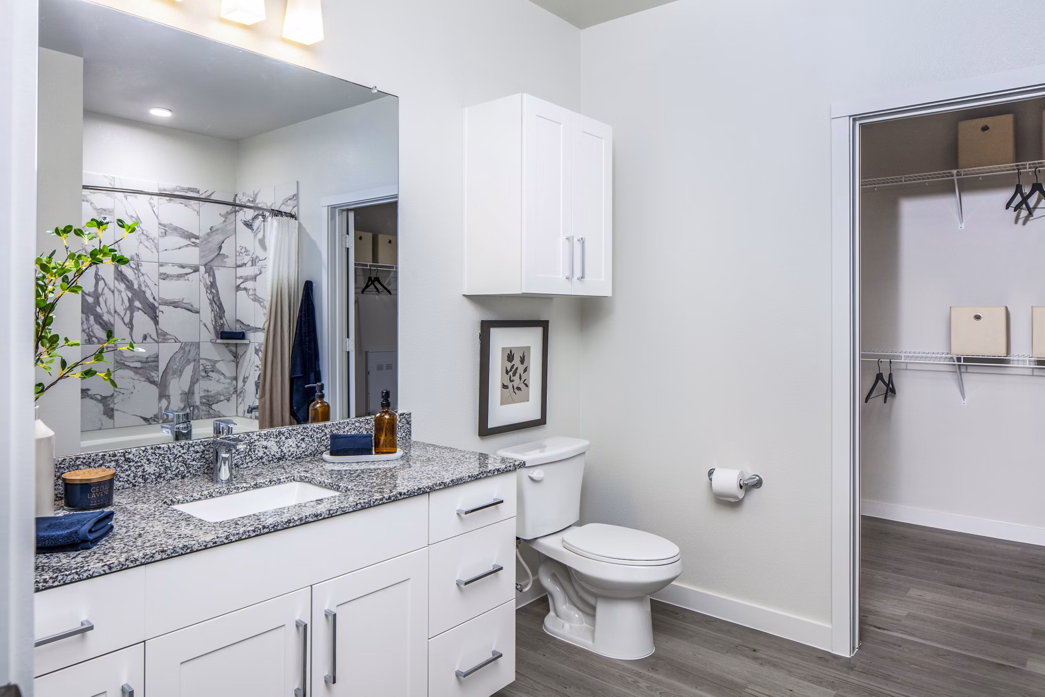 Bathroom featuring modern fixtures and elegant quartz countertops at Prose Hardy Yards Apartments