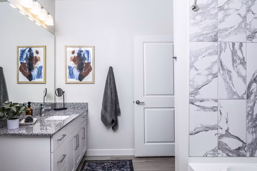 Modern bathroom with sleek fixtures and vanity at Prose Hardy Yards Apartments