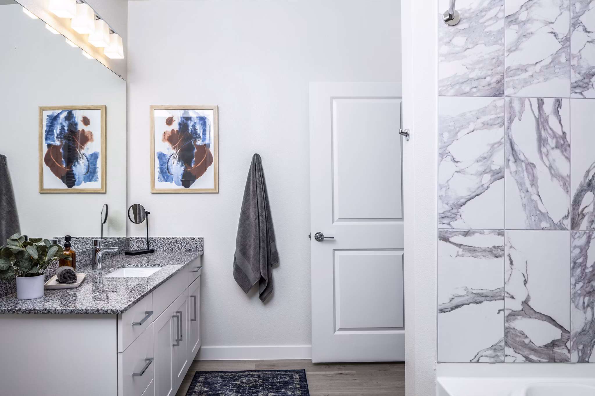 Modern bathroom with sleek fixtures and vanity at Prose Hardy Yards Apartments