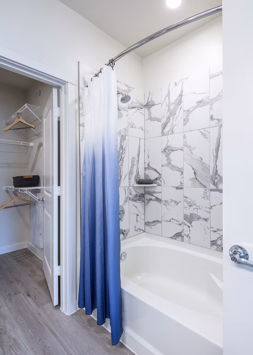 Bathroom showcasing modern fixtures and granite countertops in Prose Hardy Yards Apartments