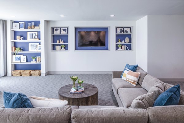 Clubhouse featuring modern design and open seating at Prose Hardy Yards Apartments, perfect for community gatherings and events