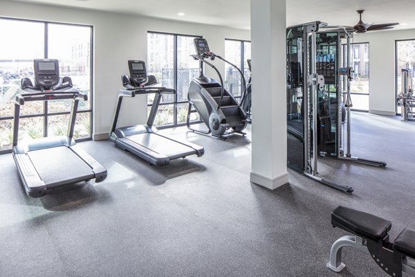 Modern fitness center with state-of-the-art equipment at Prose Hardy Yards Apartments