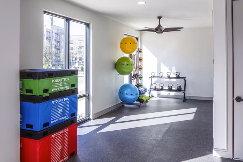 State-of-the-art fitness center at Prose Hardy Yards Apartments featuring modern exercise equipment