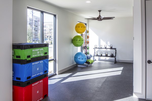 State-of-the-art fitness center at Prose Hardy Yards Apartments featuring modern exercise equipment