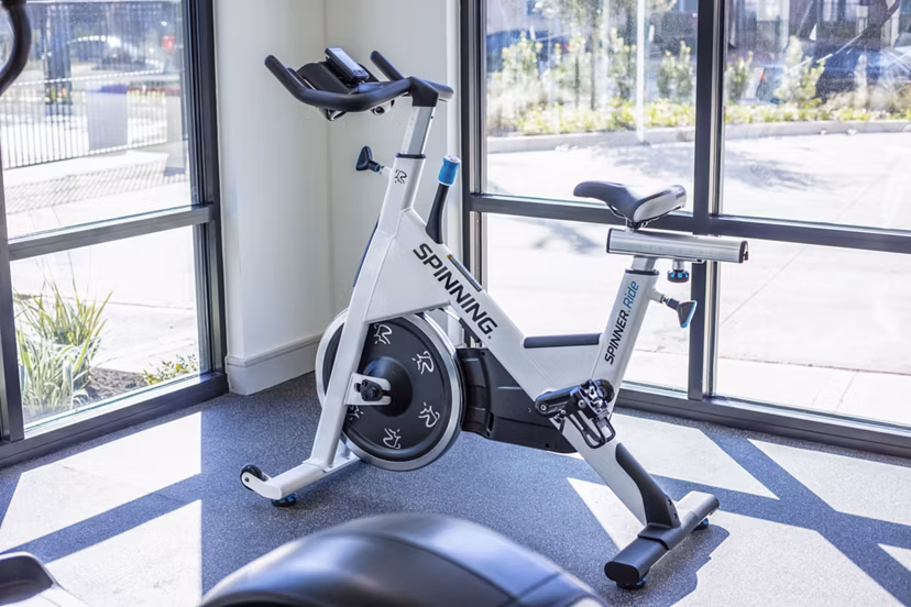 Spin studio with modern equipment at Prose Hardy Yards Apartments, offering fitness amenities for residents in stylish surroundings