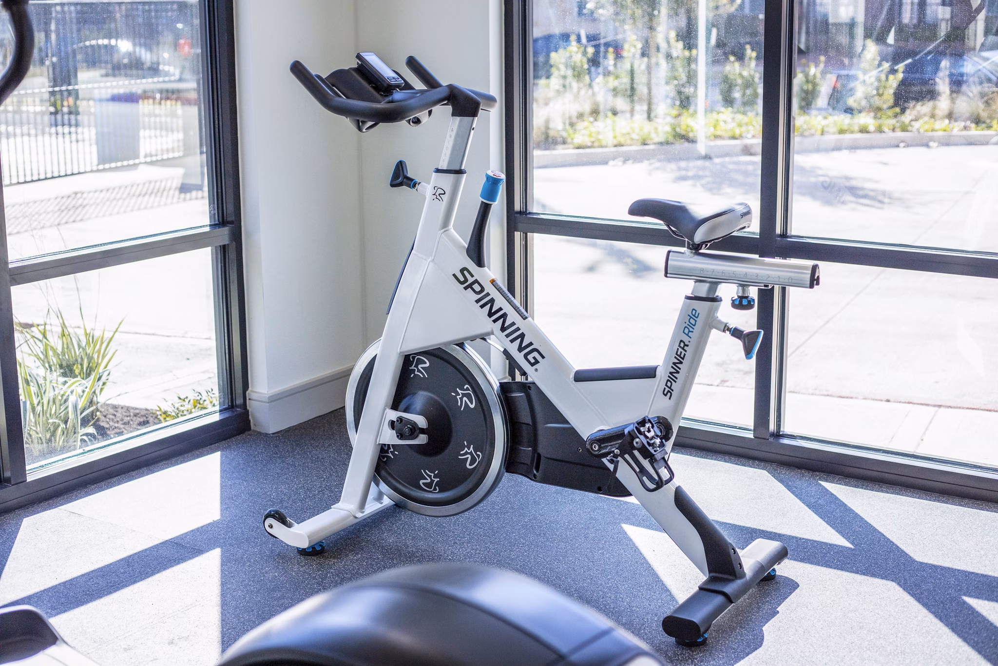 Spin studio with modern equipment at Prose Hardy Yards Apartments, offering fitness amenities for residents in stylish surroundings