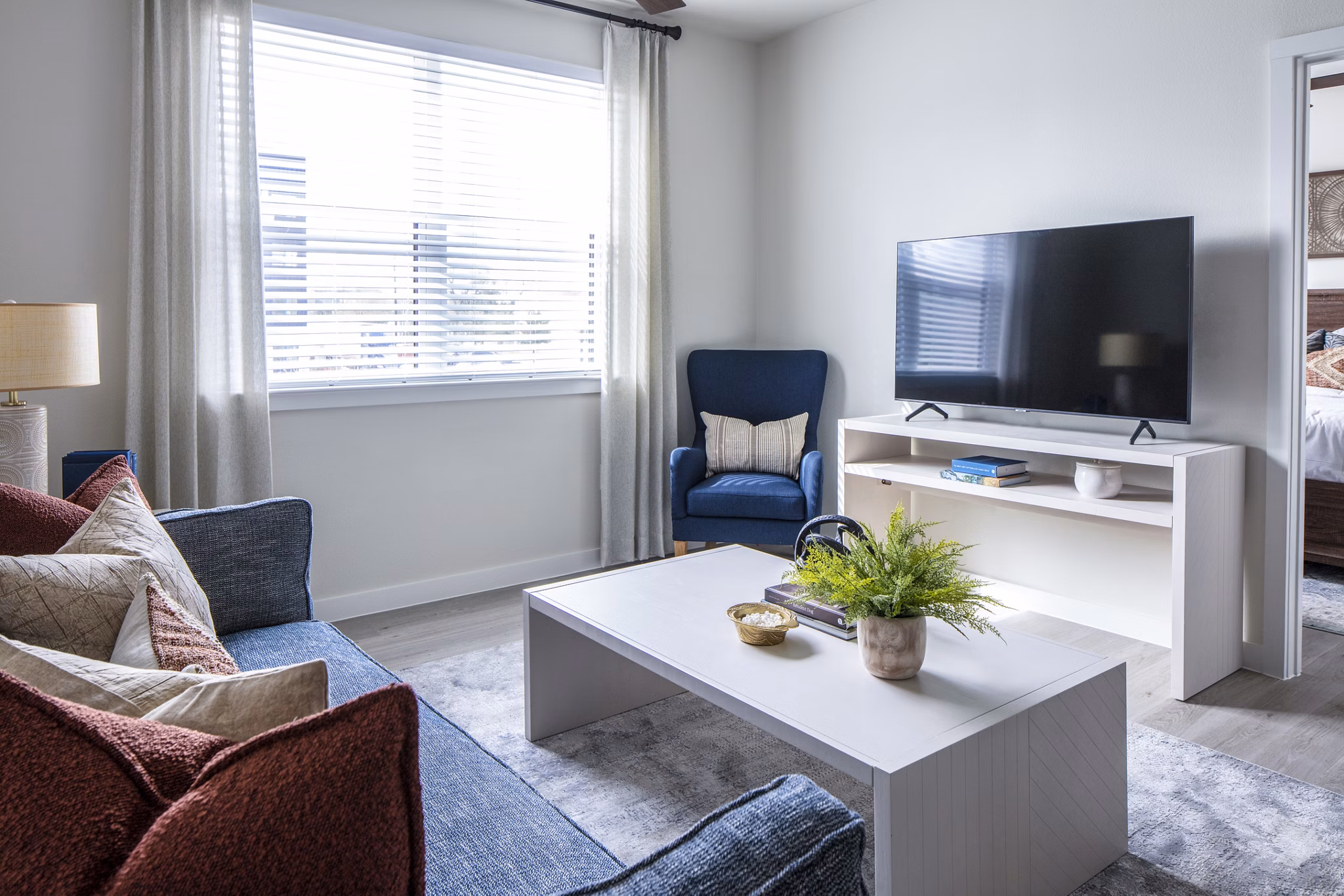 Spacious living room with modern furnishings at Prose Hardy Yards Apartments