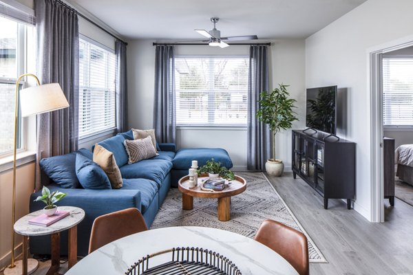 **Living room with stylish furnishings at Prose Hardy Yards Apartments**
