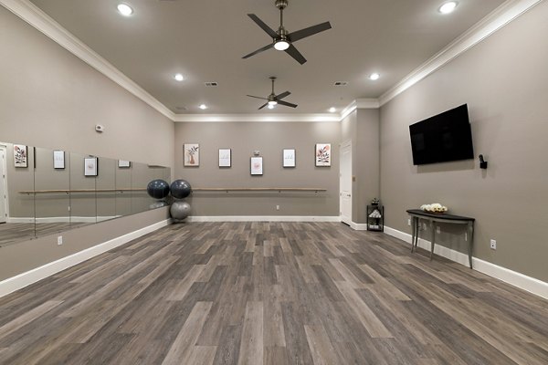 fitness center at Ivy Point Cypress Apartments 