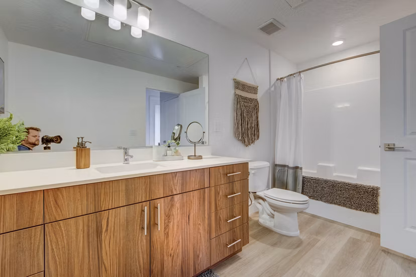 Modern bathroom with marble countertops at Aspire Apartments, luxury living spaces for comfort and style