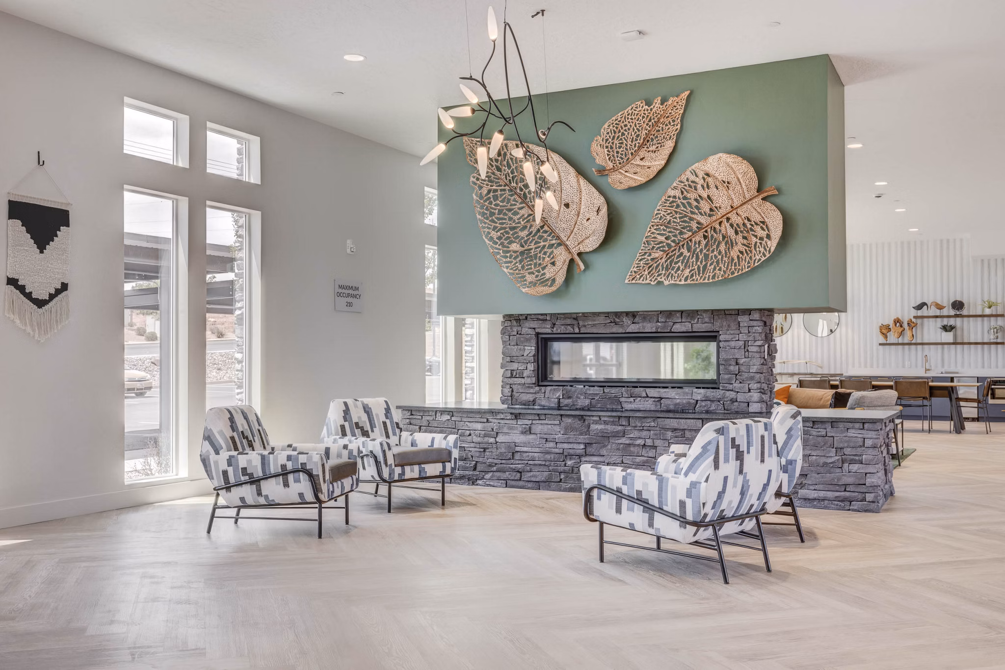 Modern clubhouse with lounge seating and entertainment space at Aspire Apartments