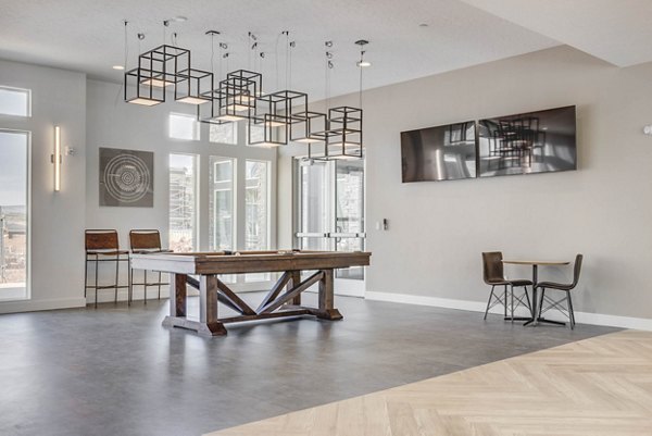 Game room featuring pool table and lounge chairs at Aspire Apartments