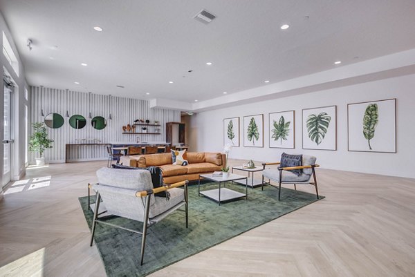 Clubhouse featuring modern seating and large TV at Aspire Apartments