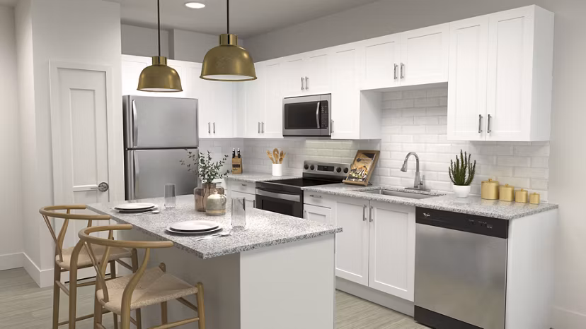 Modern kitchen with granite countertops and stainless steel appliances at Citizen House Kyle Apartments