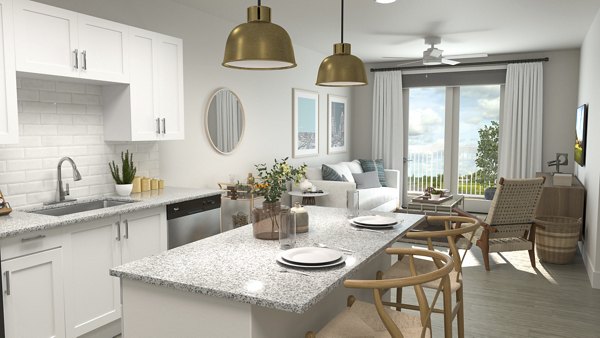 Modern kitchen with stainless steel appliances in Citizen House Kyle Apartments