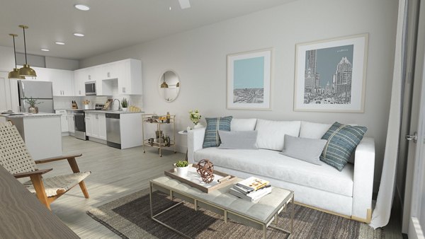 Open-concept living room with modern dÃ©cor at Citizen House Kyle apartments, offering a luxurious lifestyle