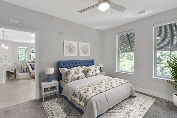 Modern bedroom with elegant decor in Aquatera Apartments, luxury living in San Diego