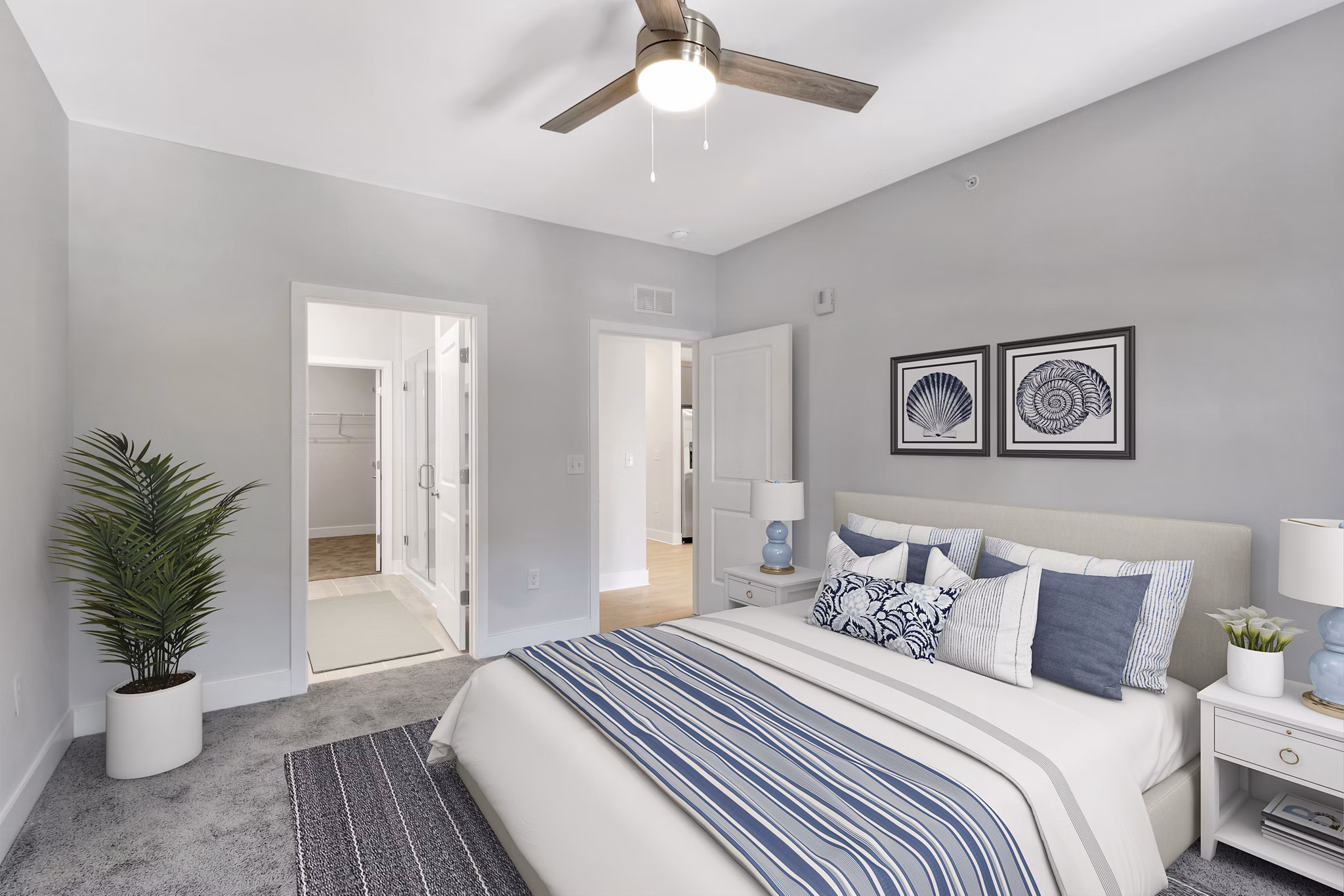 Bedroom with modern furnishings at Aquatera Apartments in San Diego