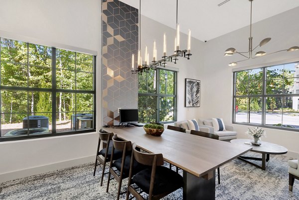 Spacious meeting facility with conference table and chairs at Aquatera Apartments
