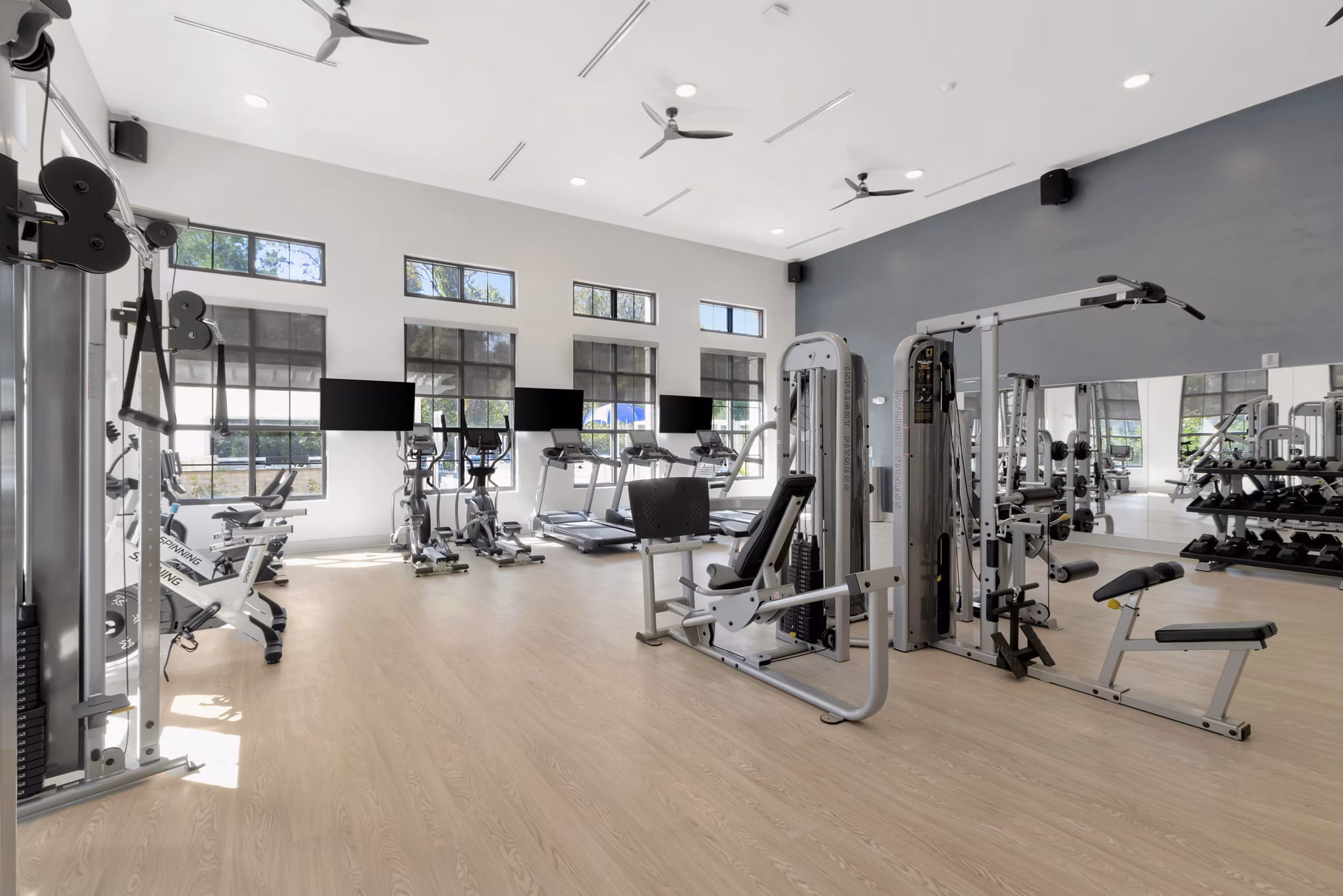 State-of-the-art fitness center at Aquatera Apartments with modern equipment and spacious workout areas