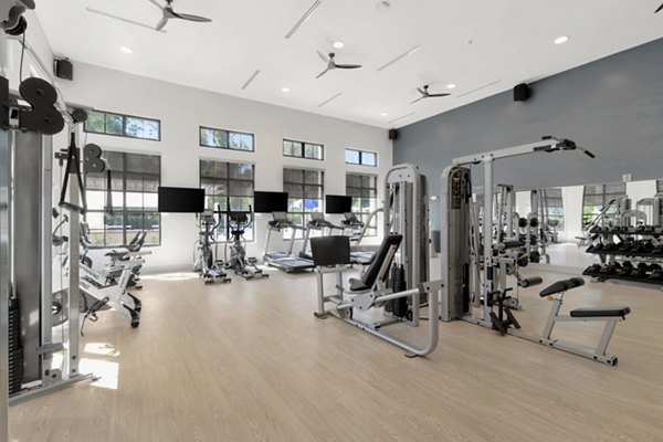 State-of-the-art fitness center at Aquatera Apartments with modern equipment and spacious workout areas