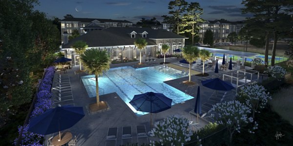 Resort-style pool with lounge seating at Aquatera Apartments
