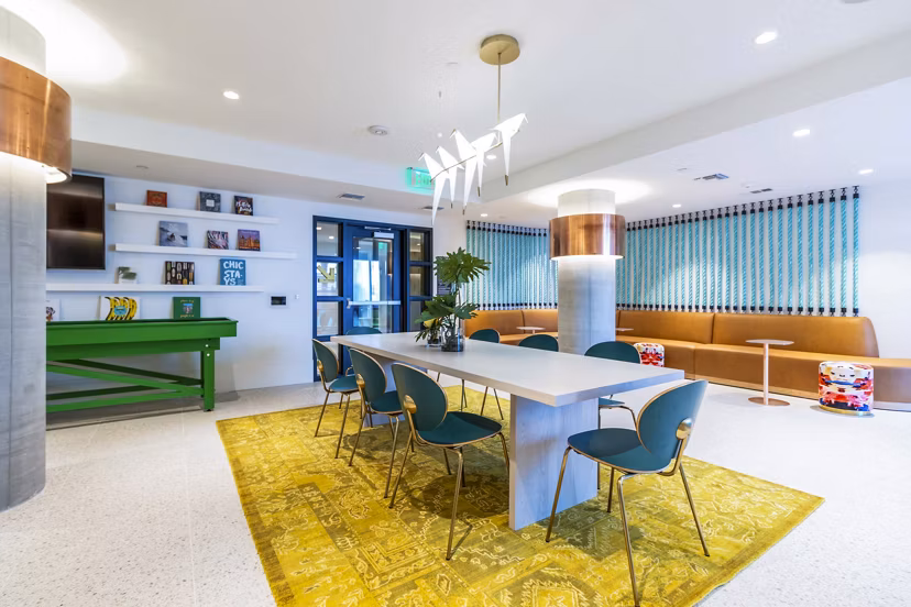Clubhouse game room featuring modern decor and billiards at Gravity Apartments