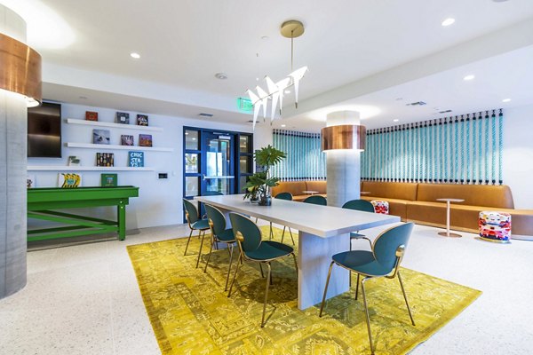 Clubhouse game room featuring modern decor and billiards at Gravity Apartments