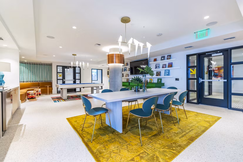 Clubhouse with modern design at Gravity Apartments in vibrant downtown, featuring social areas and entertainment options for residents