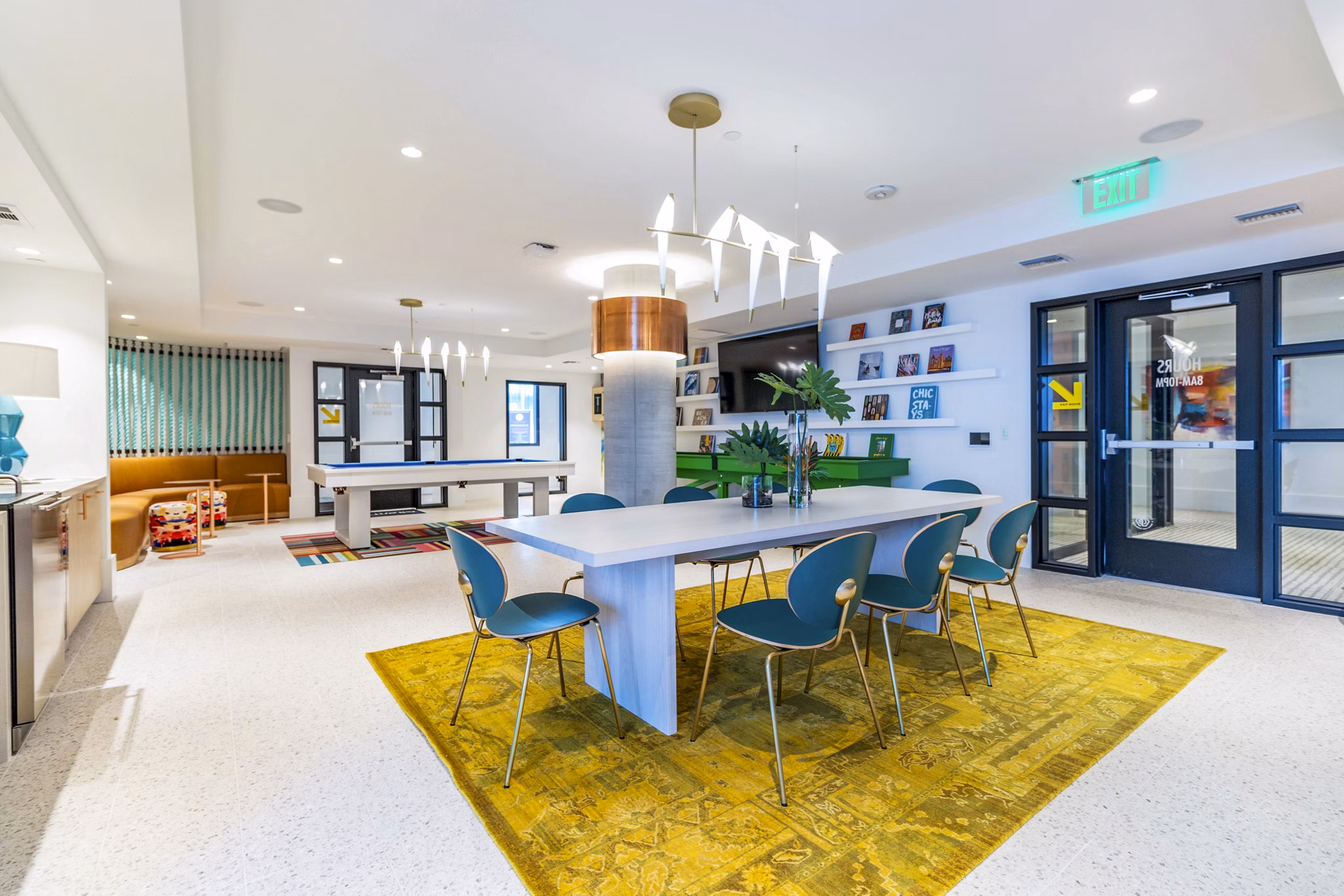 Clubhouse with modern design at Gravity Apartments in vibrant downtown, featuring social areas and entertainment options for residents