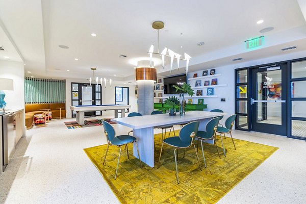 Clubhouse with modern design at Gravity Apartments in vibrant downtown, featuring social areas and entertainment options for residents
