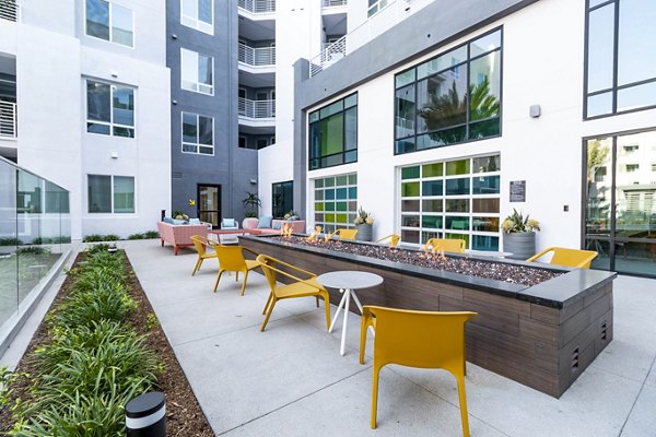 Cozy fire pit area on modern patio at Gravity Apartments