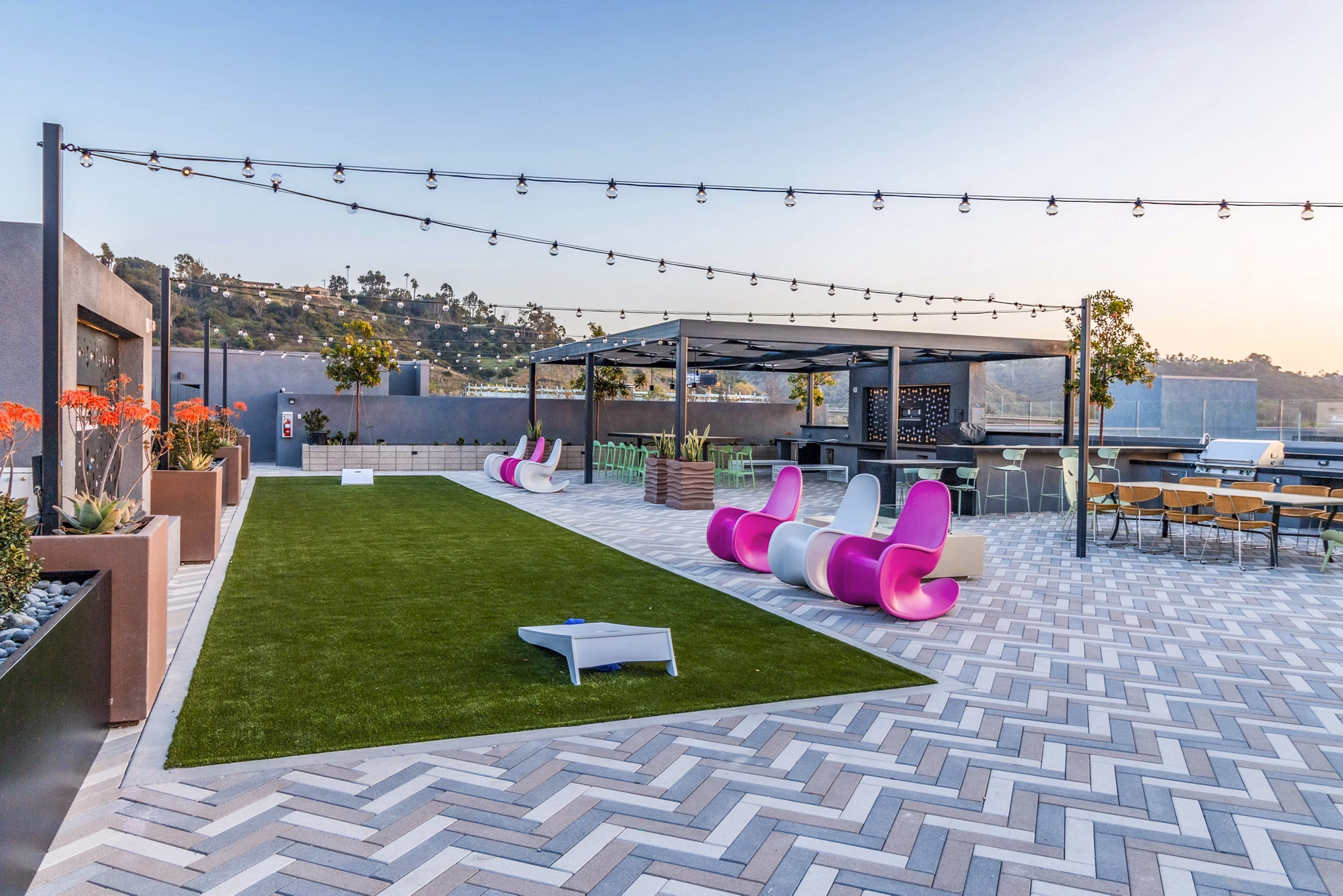 Recreational area with modern seating and game tables at Gravity Apartments, a luxury living community