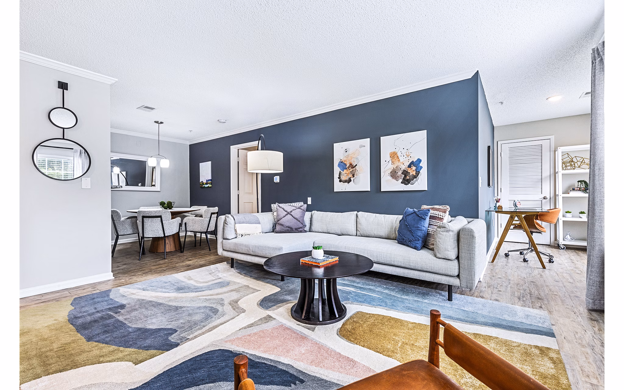 Modern living room with chic decor and ample natural light in Vista Commons Apartments