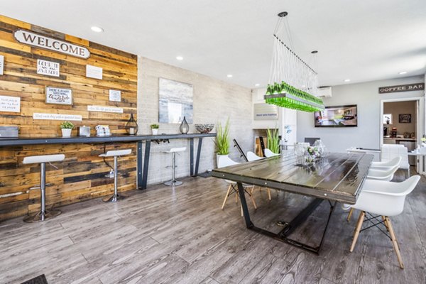 Modern clubhouse with stylish seating and large windows at Crosstown Phoenix West Apartments