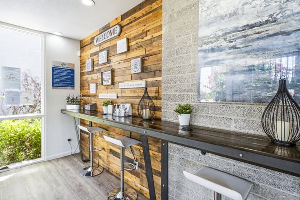 Modern business center with coworking spaces at Crosstown Phoenix West Apartments clubhouse