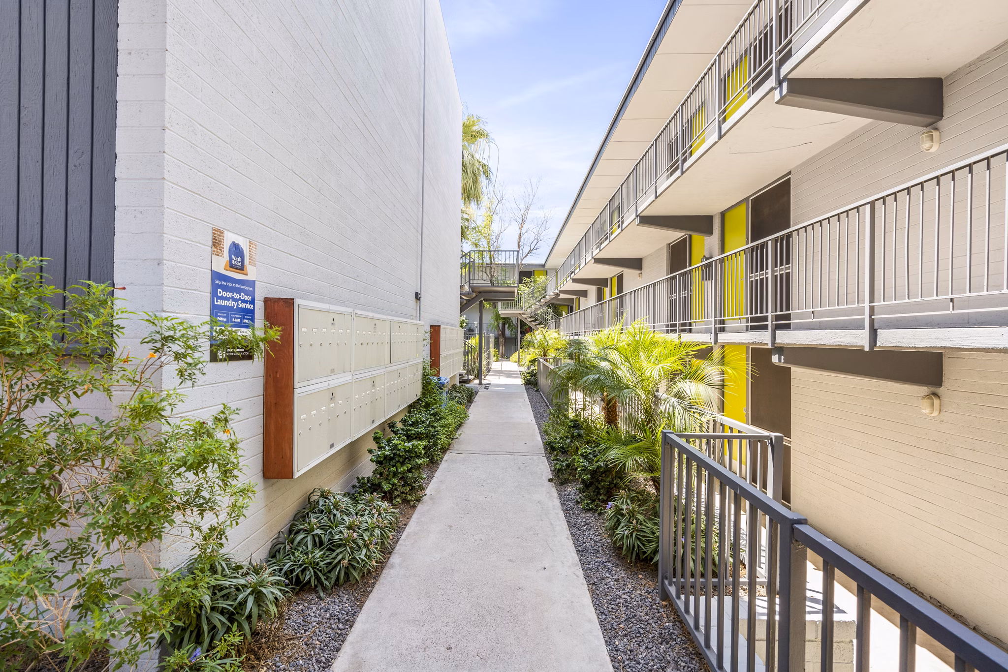 Modern mail room with secure package lockers at Crosstown Phoenix West Apartments