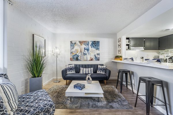 Spacious living room with modern decor at Crosstown Phoenix West Apartments