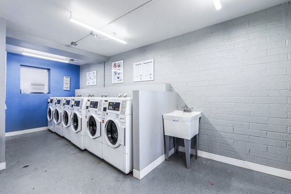 Laundry facility with modern machines at Crosstown Phoenix West Apartments, offering convenient amenities for residents