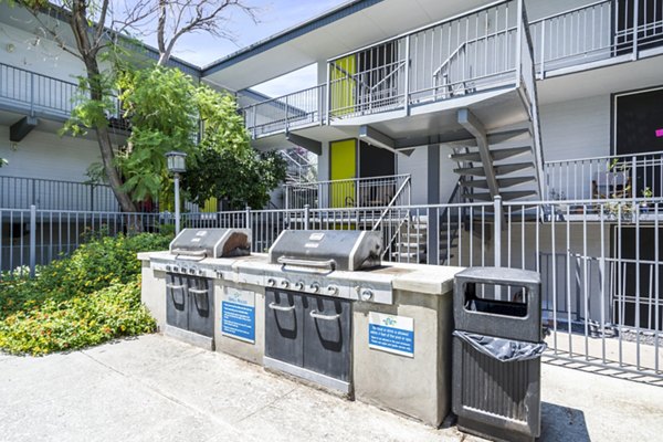 Spacious grill area with modern patio furnishings at Crosstown Phoenix West Apartments