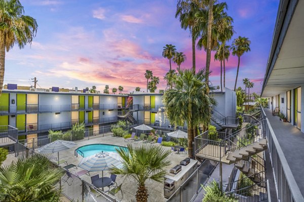 Resort-style pool with lounge seating at Crosstown Phoenix West Apartments