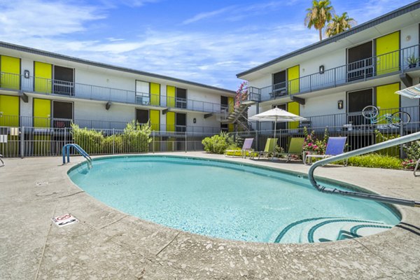 Olympic-sized pool with cabanas at Crosstown Phoenix West Apartments offering luxurious swimming experience