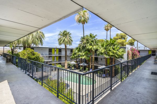 Inviting swimming pool area with lounge chairs at Crosstown Phoenix West Apartments
