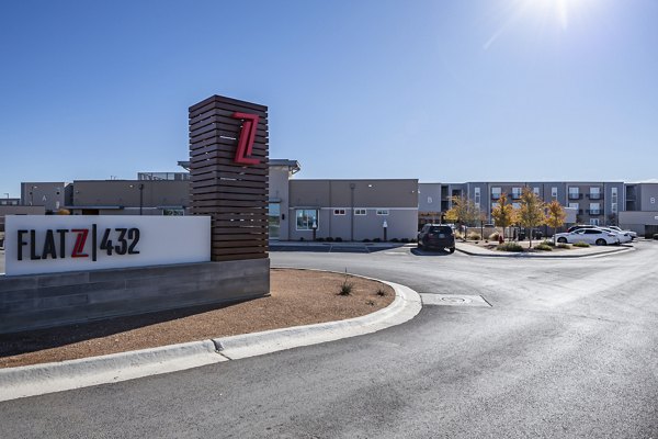 FLATZ 432 Apartments signage showcasing contemporary design in an upscale community setting